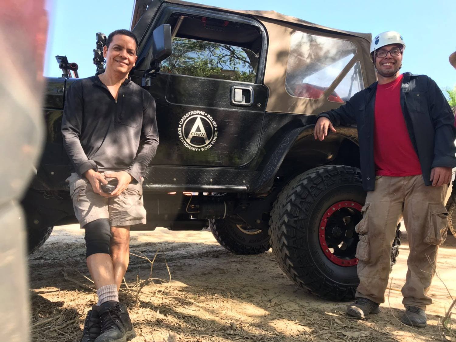 Two crew members with Alpha CREW Jeep in Utuado mountains